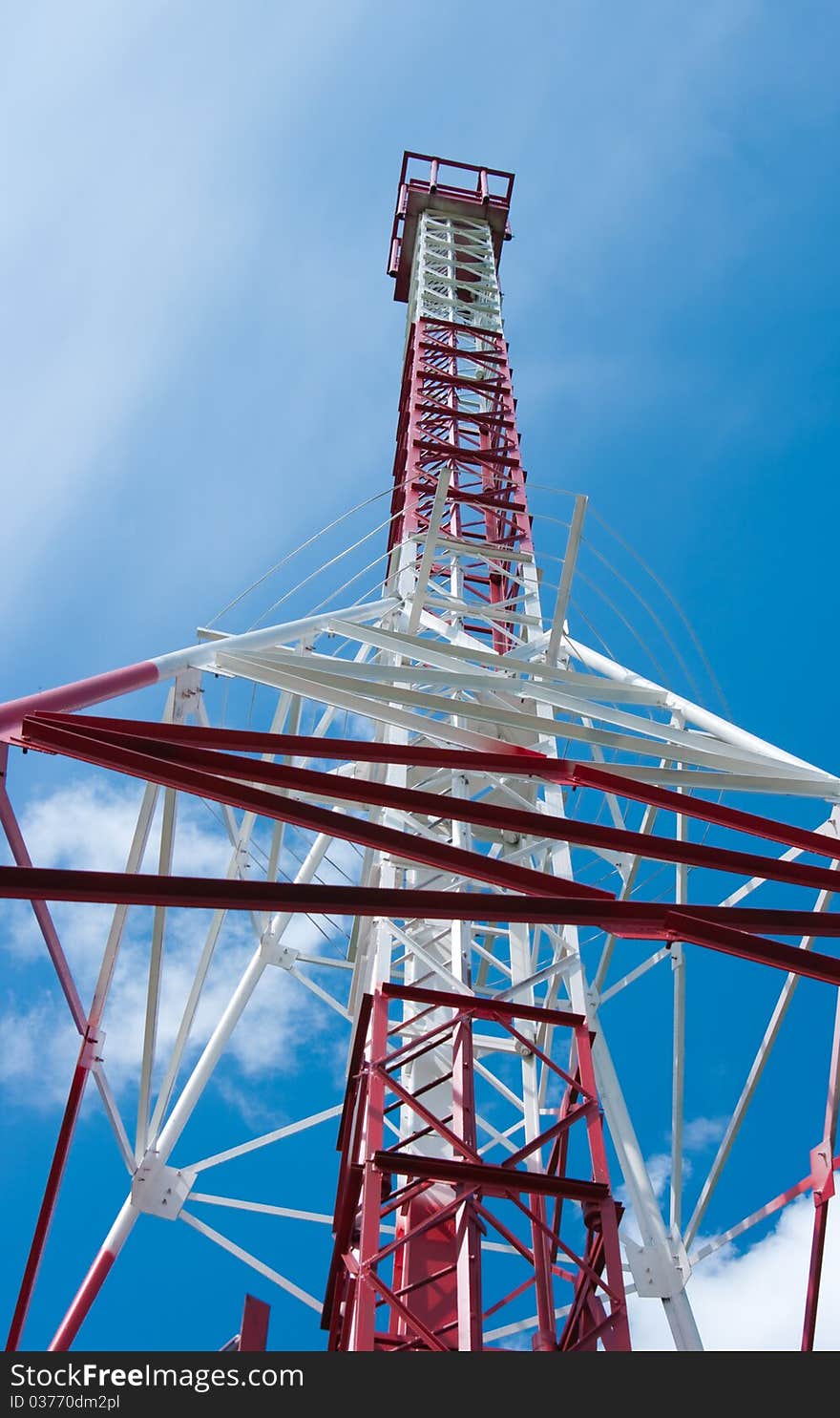The image of the Mast of communication against the blue sky. The image of the Mast of communication against the blue sky