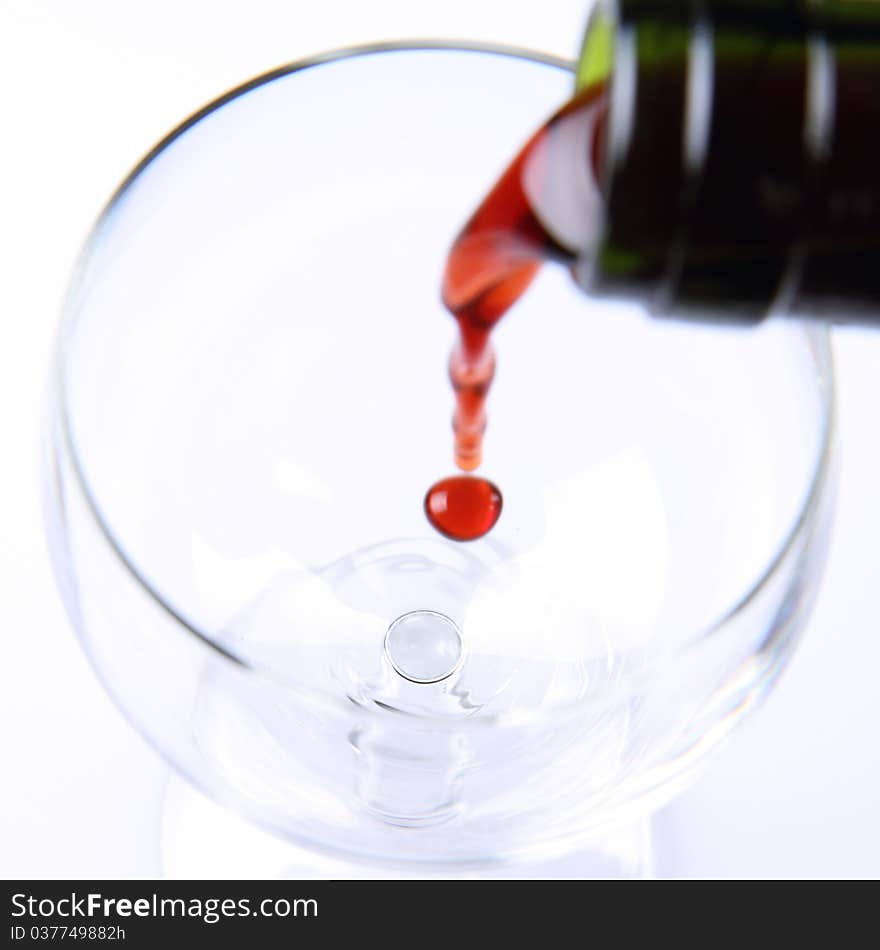 Red wine being poured into a wine glass