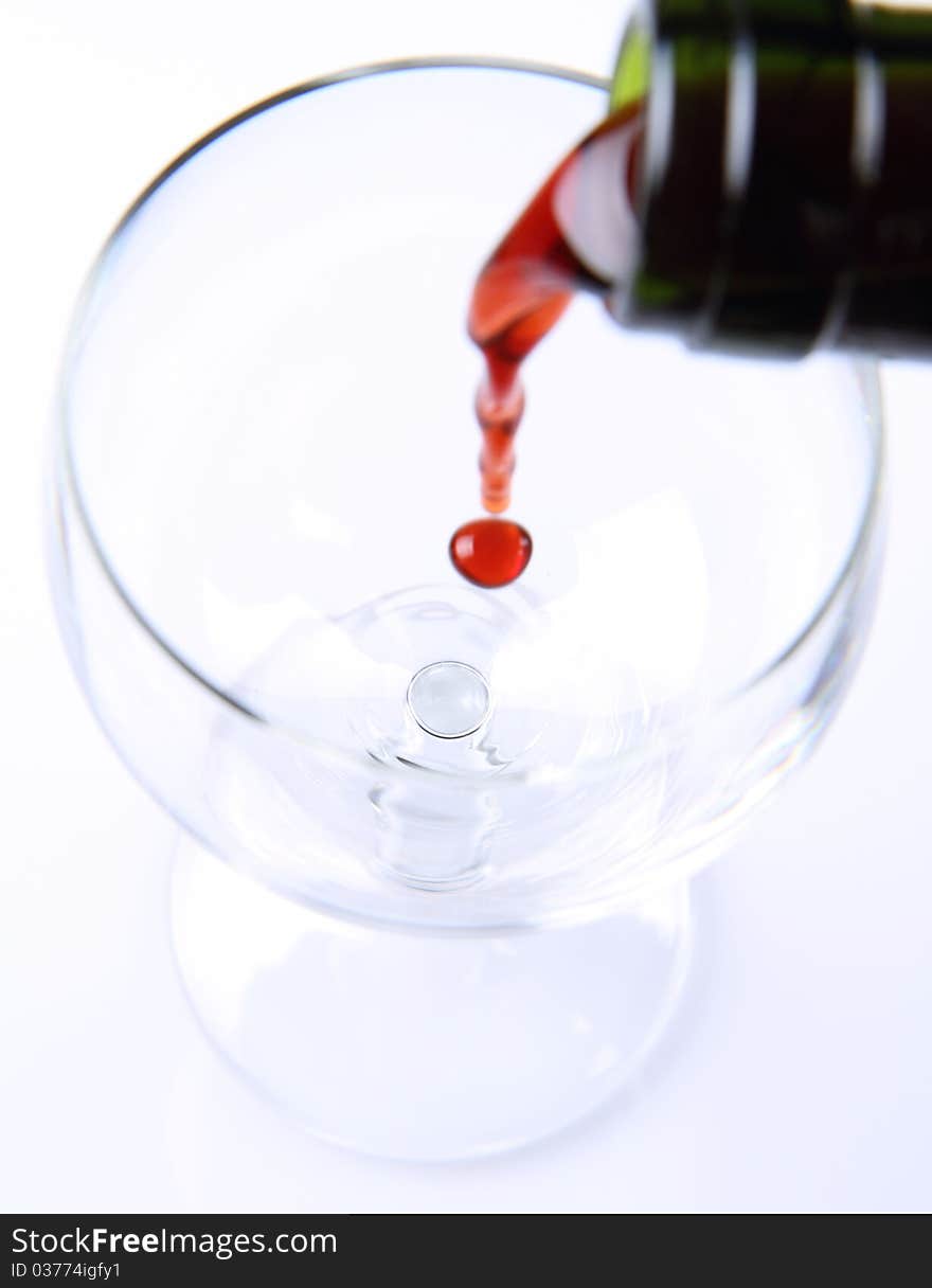 Red wine being poured into a wine glass