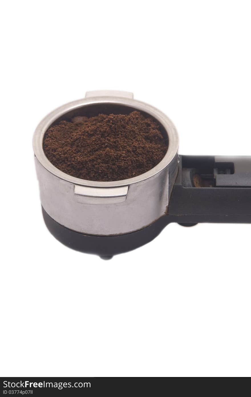 Portion of natural, ground coffee on a white background