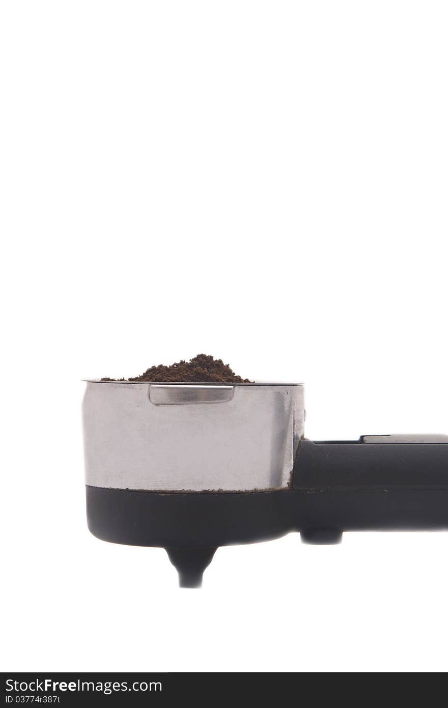 Portion of natural, ground coffee on a white background