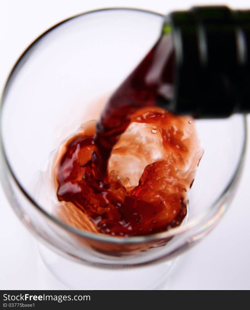 Red wine being poured into a wine glass