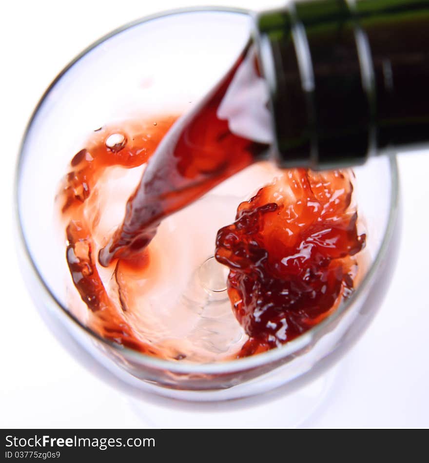 Red wine being poured into a wine glass