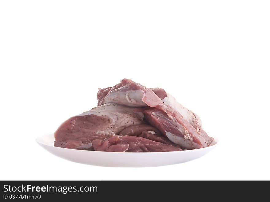 Crude meat on a plate