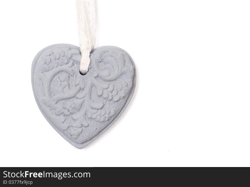 Grey stone heart with patterns on white background. Grey stone heart with patterns on white background