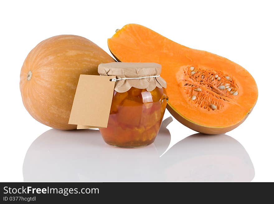 Jar with sweet of pumkins isolated on white background