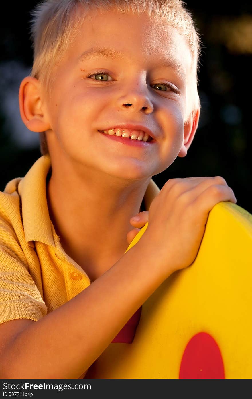 Portrait of smiling little boy - golden light