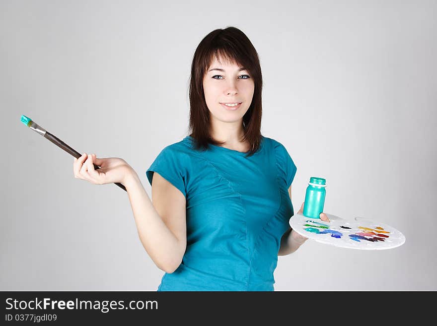 Girl Standing And Holding Brush And Palette