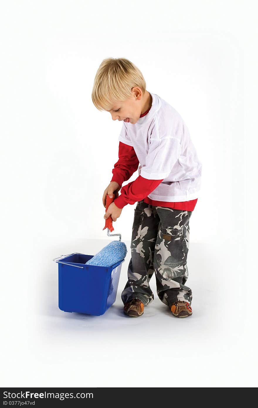 Little dirty worker with paint roller and blue pail  isolated on white. Little dirty worker with paint roller and blue pail  isolated on white