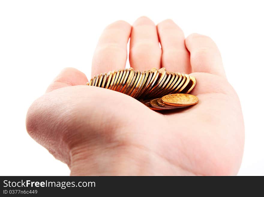 Hand hold gold coins.  Isolated