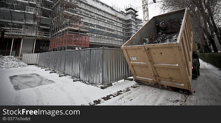 Truck in the yard in snowy landscape