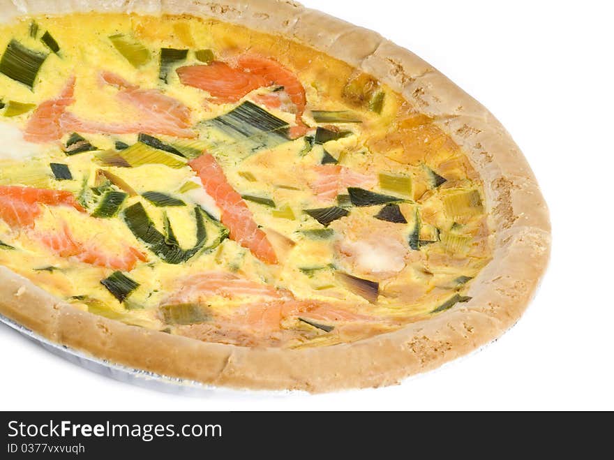 Colorful baked salmon quiche isolated on white.