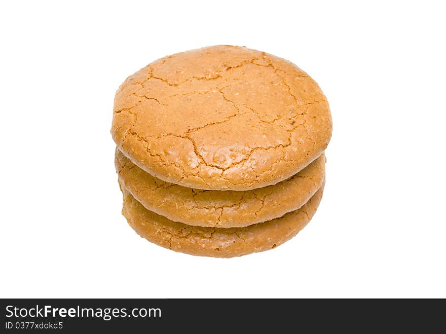 Three almond cakes are combined by a pile. On a white background