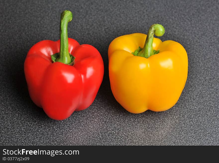 Two peppers on a kitchen table