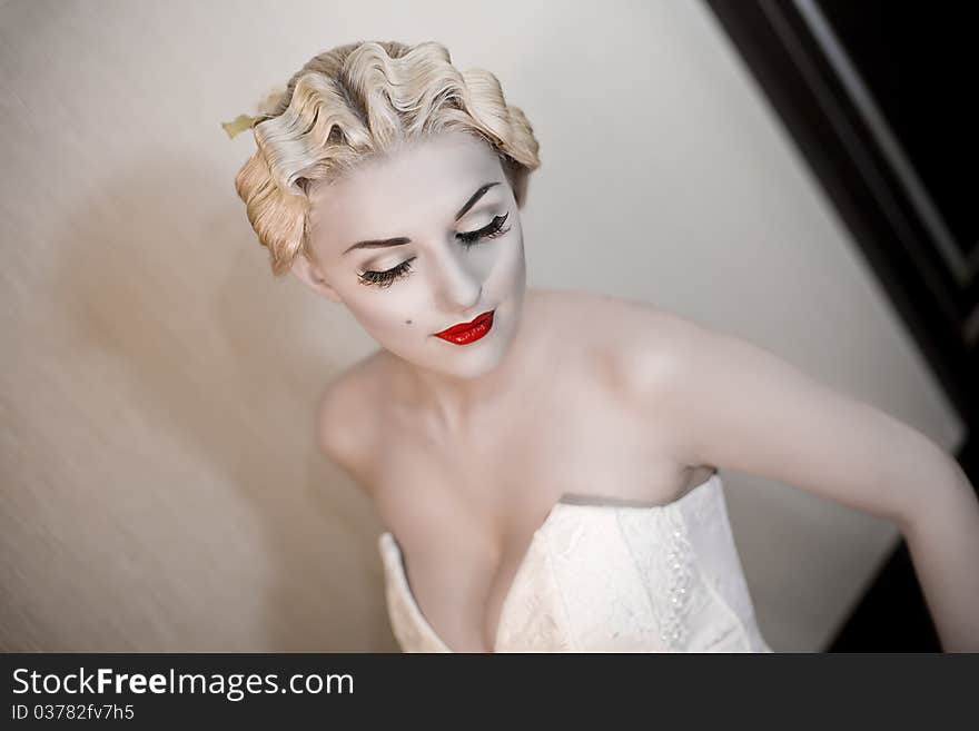 Fashion portrait of young beautiful woman with red lips