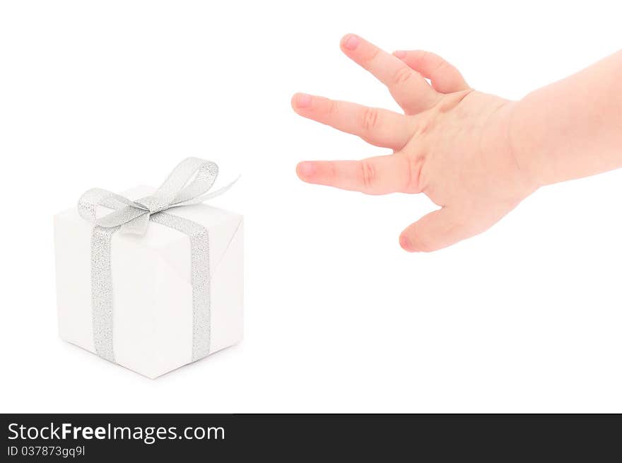 A child's hand taking a gift.  Isolated on white.