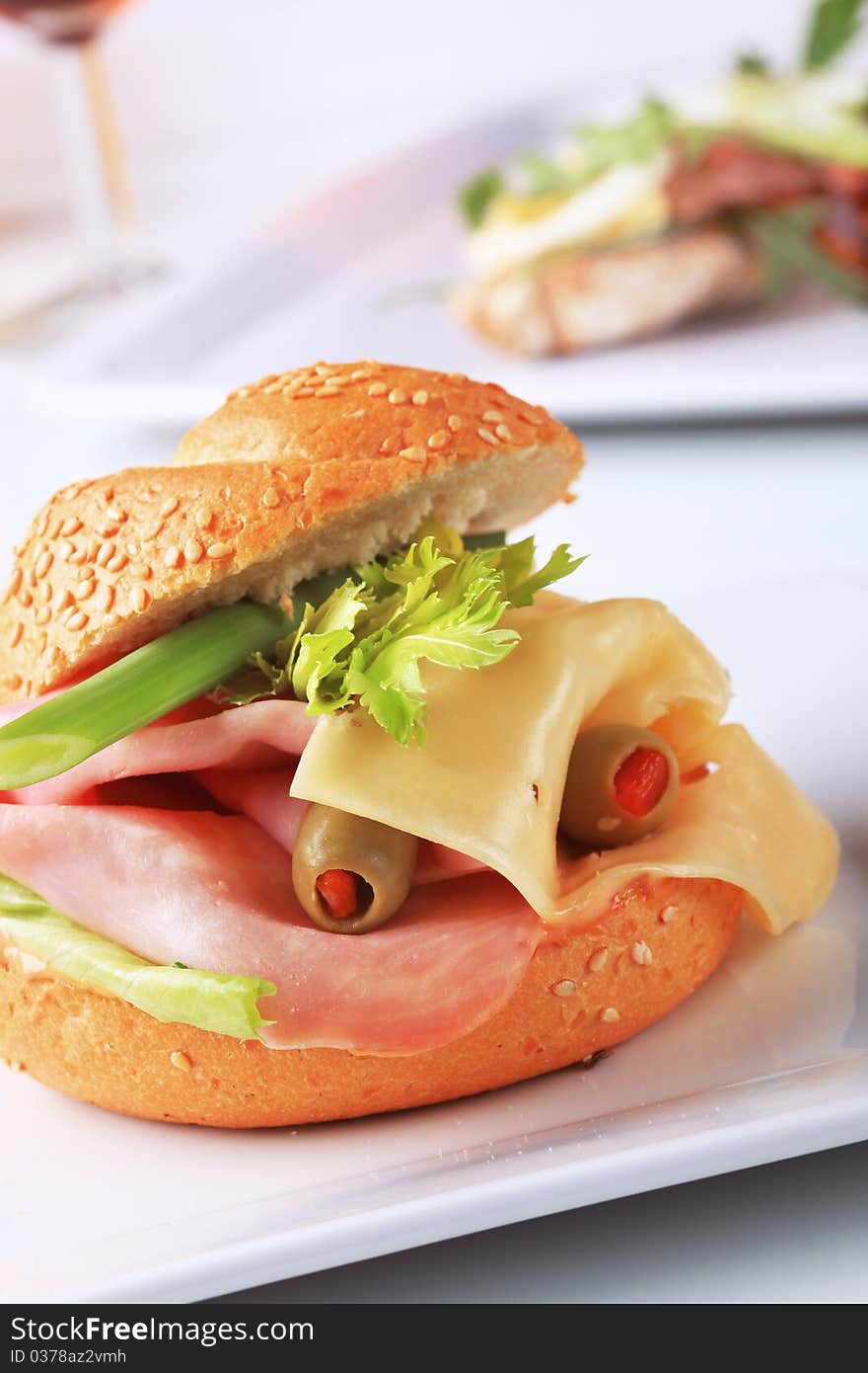 Sesame seed bun with ham and cheese. Sesame seed bun with ham and cheese