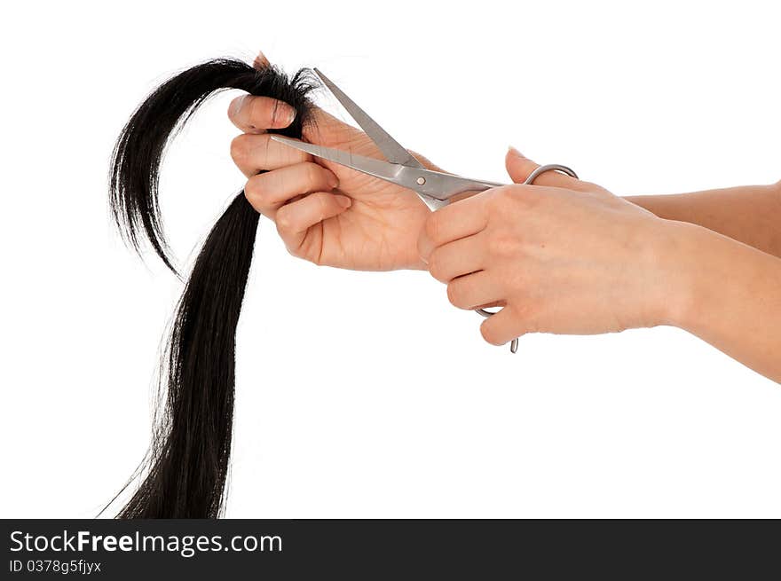 Hairdresser cutting young woman with long black hair. Hairdresser cutting young woman with long black hair