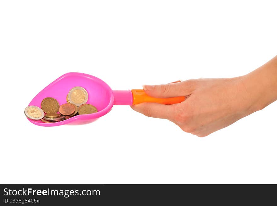 Woman holding a Children's shovel with euro coins as a symbol of the beginning of small business growth