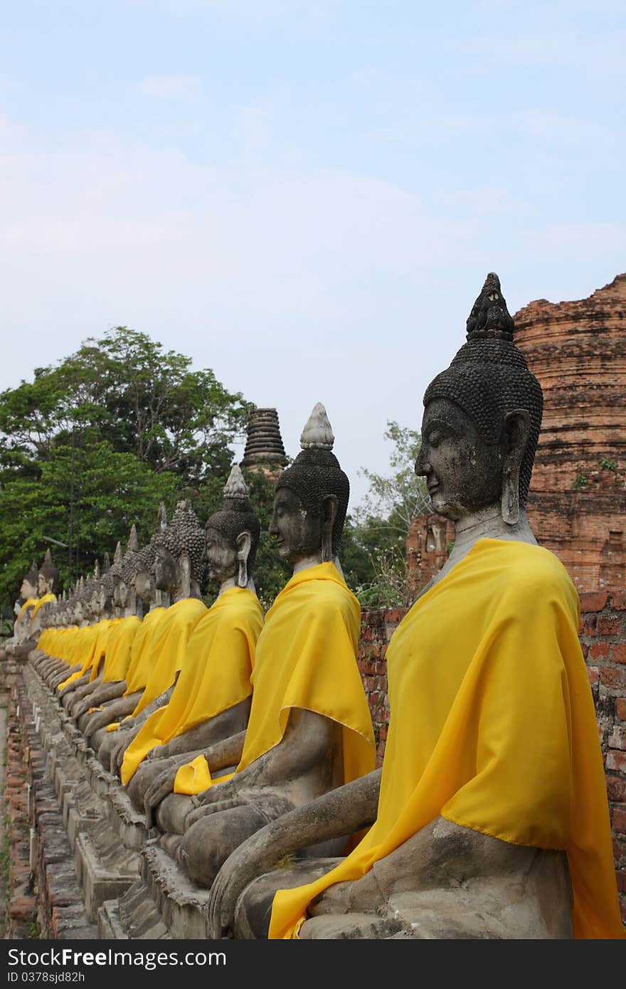 Buddha Statue in a row with sky