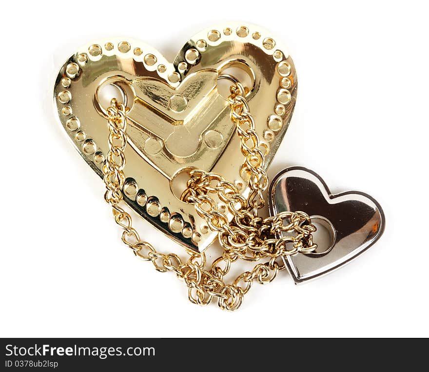 Puzzle heart of steel and chain on white background