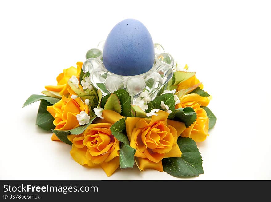 Colored egg in the glass bowl