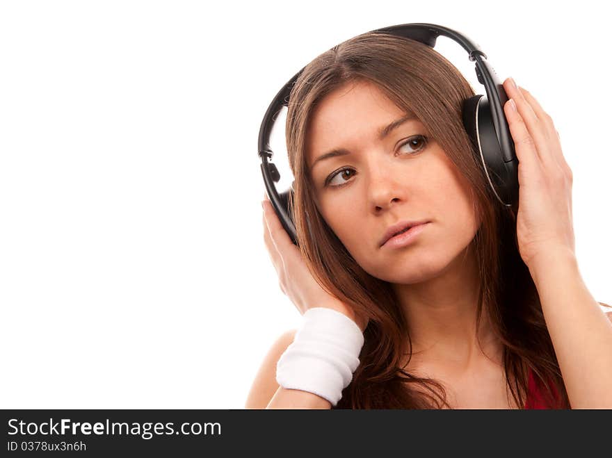 Brunette young woman listening music big headphones and thinking isolated on white background. Brunette young woman listening music big headphones and thinking isolated on white background