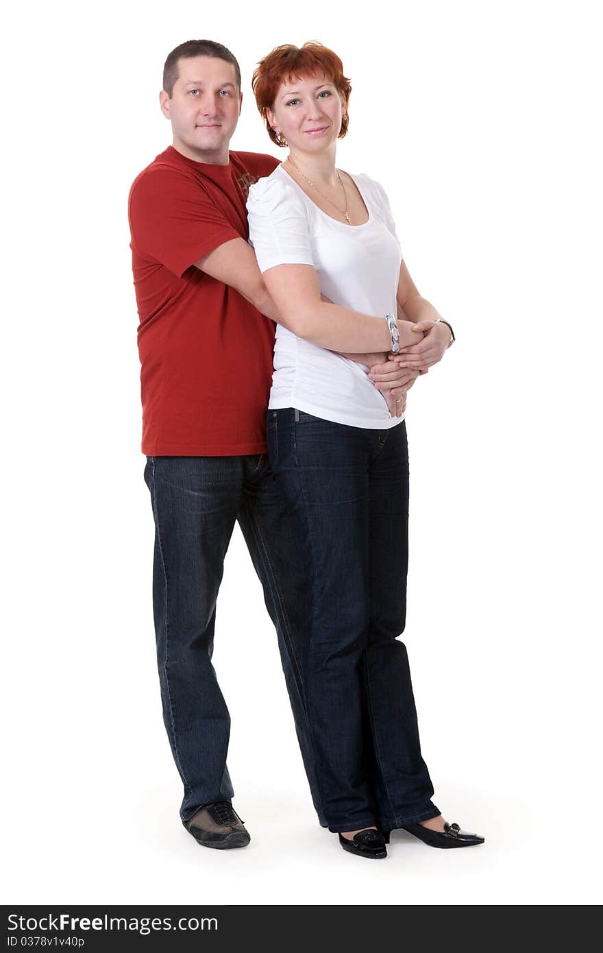 Beautiful couple hugging on a white background