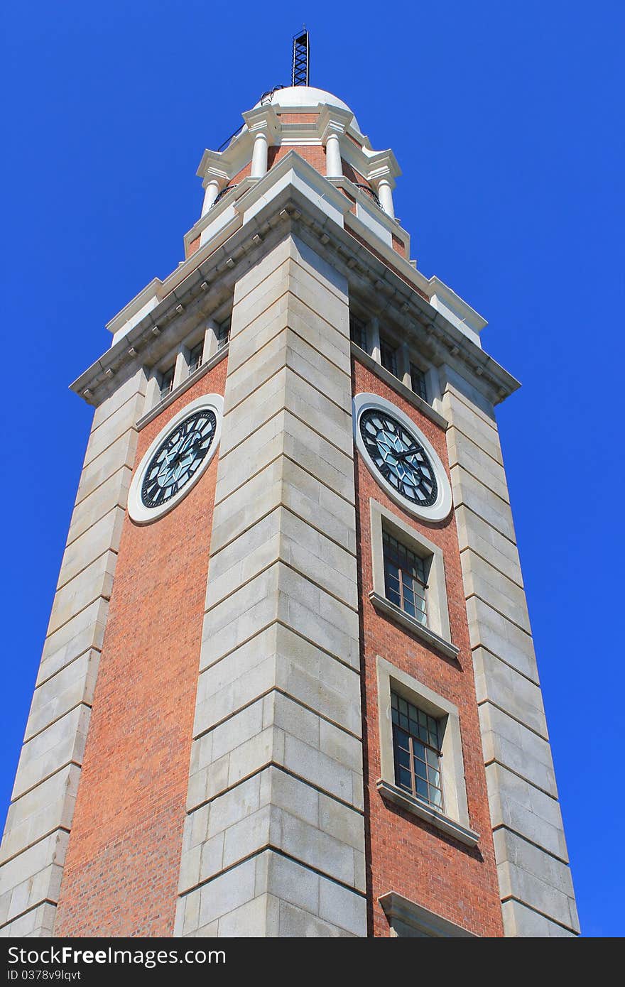 The Clock Tower is a landmark in Hong Kong. It is located on the southern shore of Tsim Sha Tsui, Kowloon. It is the only remnant of the original site of the former Kowloon Station on the Kowloon-Canton Railway. Officially named Former Kowloon-Canton Railway Clock Tower (traditional Chinese: 前九廣鐵路鐘樓), it is usually referred to as the Tsim Sha Tsui Clock Tower (traditional Chinese: 尖沙咀鐘樓) for its location. Built out of red bricks and granite, the Clock Tower peaks at 44 metres, and is topped by a 7-metre lightning rod. The top of the tower can be reached by a wooden staircase located within. The interior of Clock Tower had previously been open for visit, but is currently closed for maintenance. The clock tower is located near Victoria Harbour at the foot of Salisbury Road. Another landmark, the Tsim Sha Tsui Ferry Pier, is located nearby. The tower has been listed as a declared monument in Hong Kong since 1990.