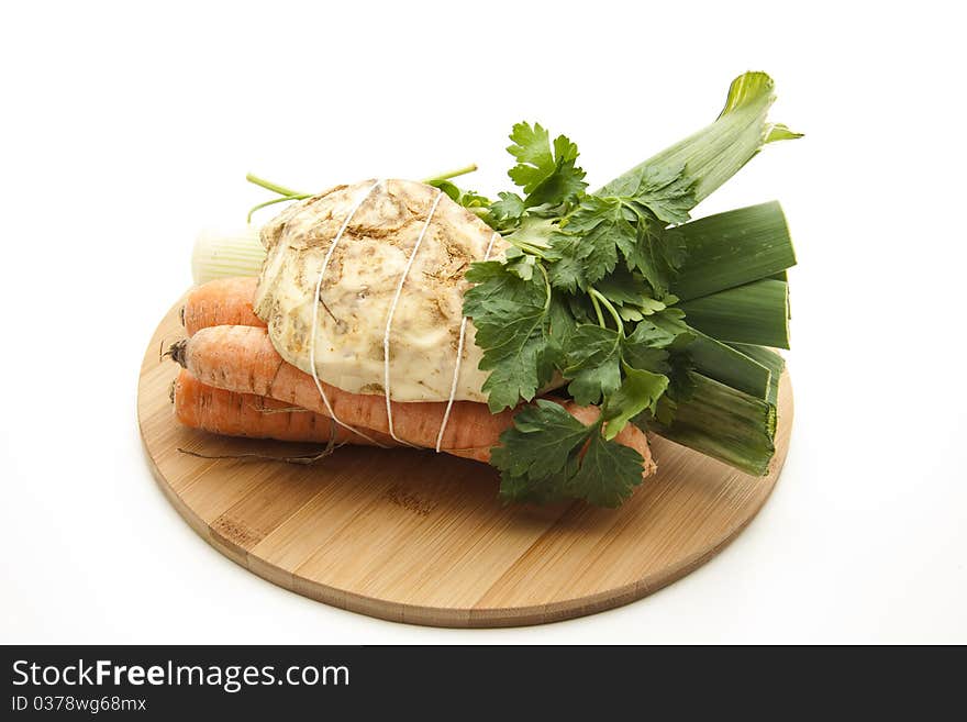 Bound soup vegetables and onto wood plates. Bound soup vegetables and onto wood plates