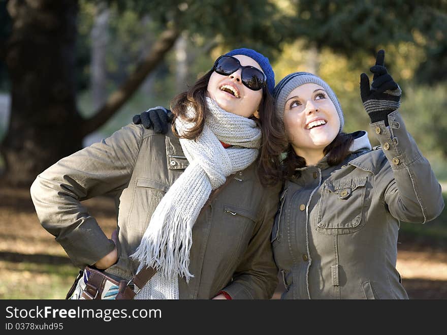 Happy two beautifull women in park. Happy two beautifull women in park