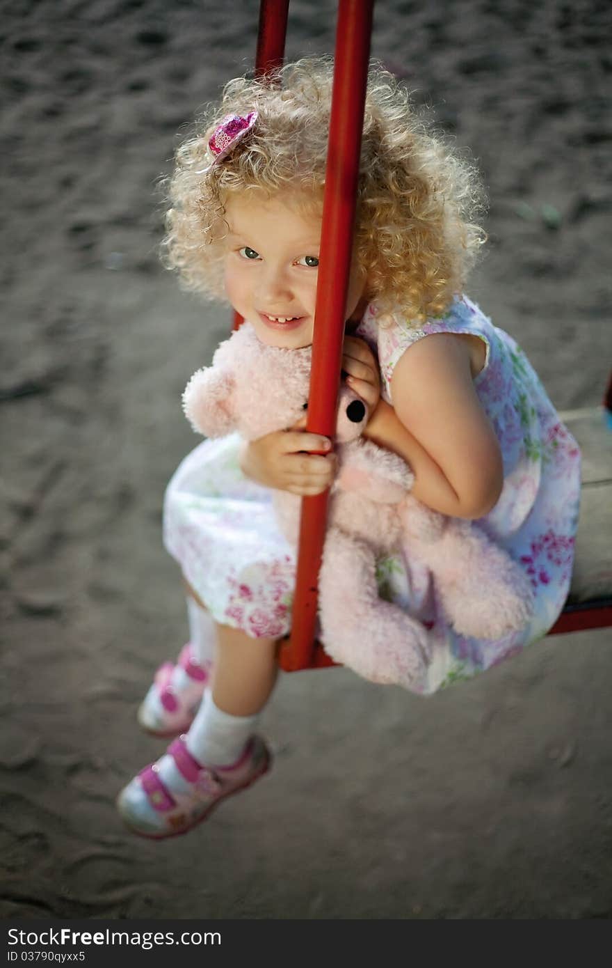 Little girl on the swing.