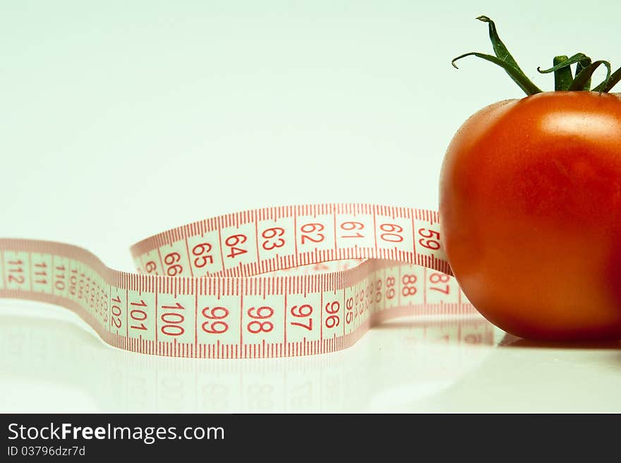 Tomato and tape measure in blye. White balance is incorrect