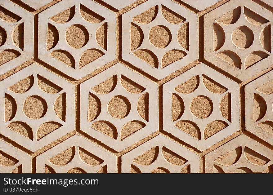 A close-up section of a grouted stone wall or floor. A close-up section of a grouted stone wall or floor