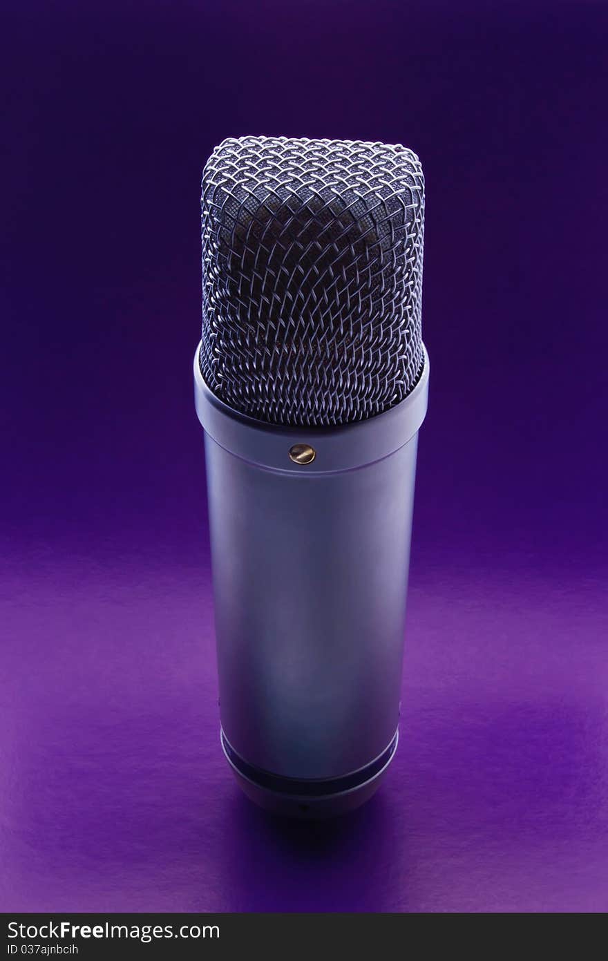 Studio microphone on a violet background