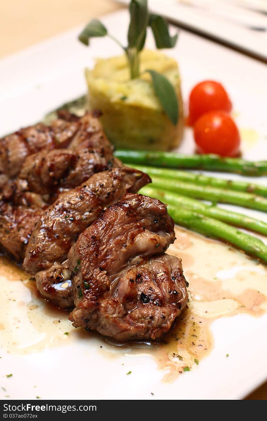 Grilled lamb on white plate