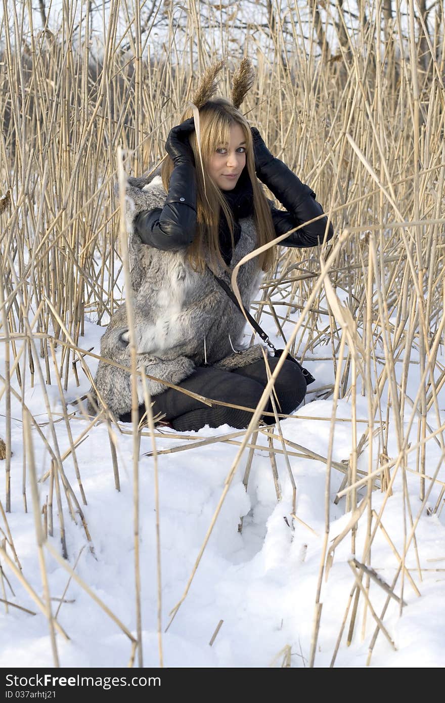 Girl walking in winter field