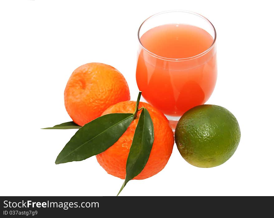 Glass of juice and citrus. Glass of juice and citrus