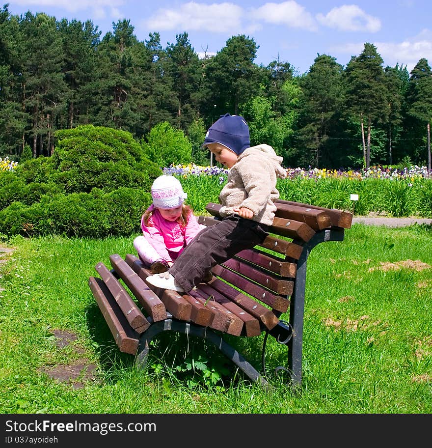 Little Boy And Girl In Park