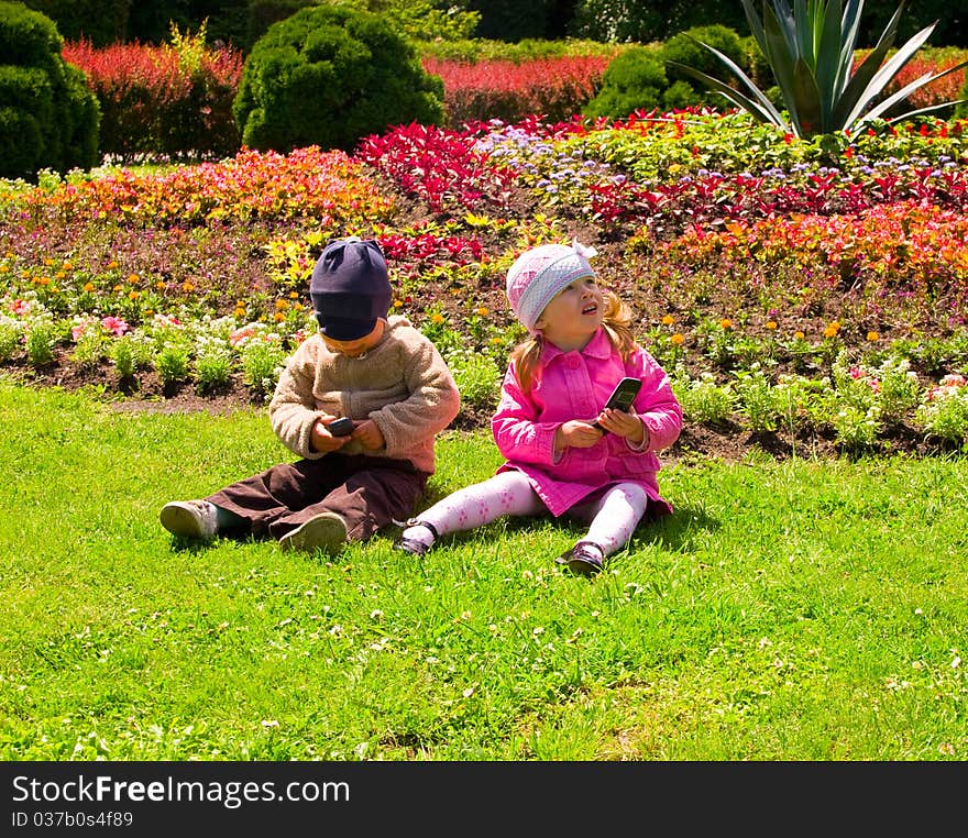 Boy And Girl Playing In The Park