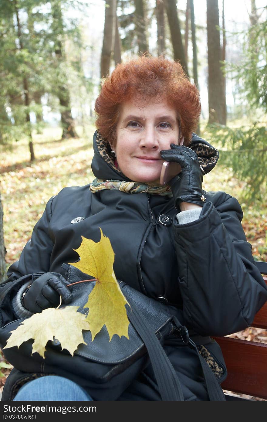 Senior Lady Portrait In Autumn Park