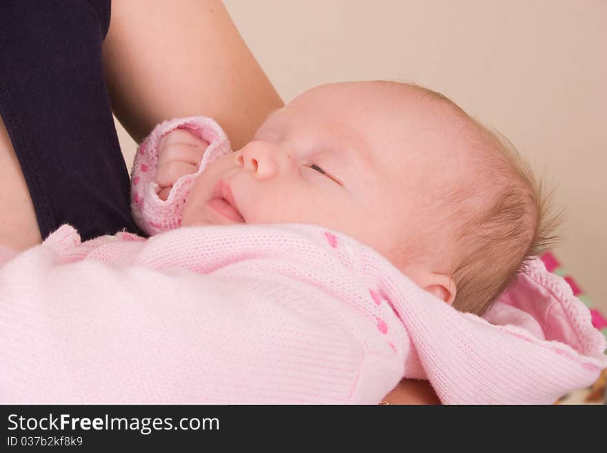 3 month old baby at mum on hands