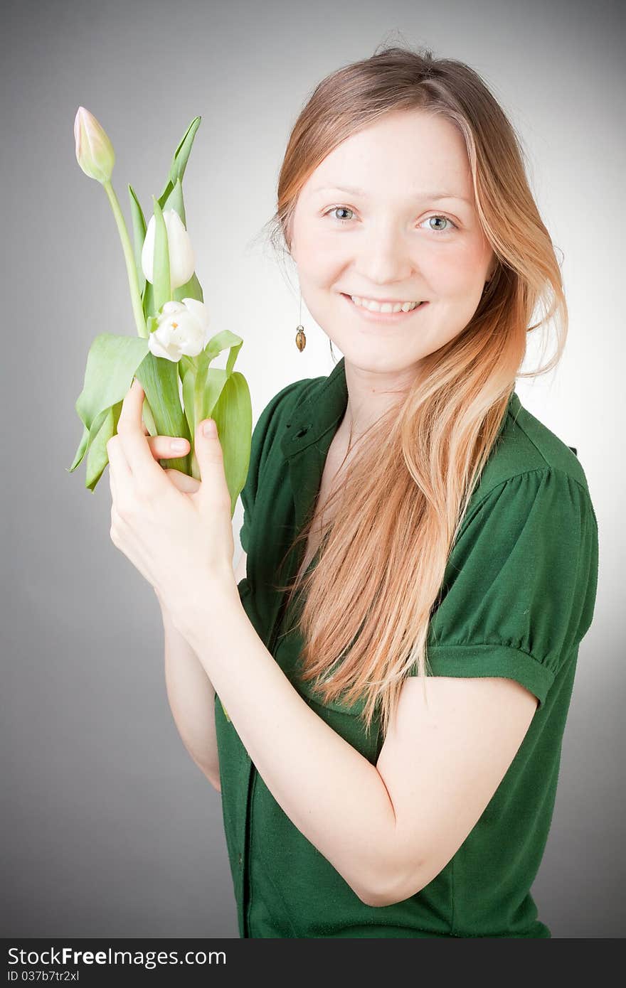 Young blonde girl with tulips