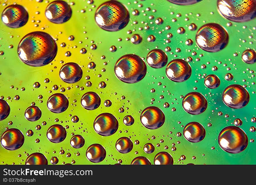 High resolution photo of water-drops on green