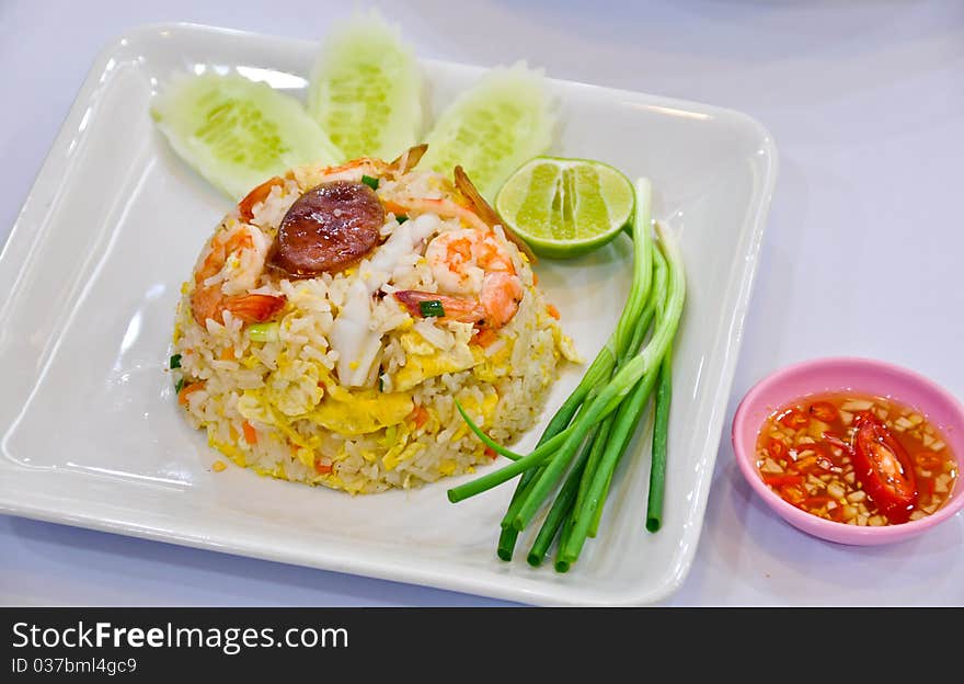 Fried rice with shrimp and vegetable on table