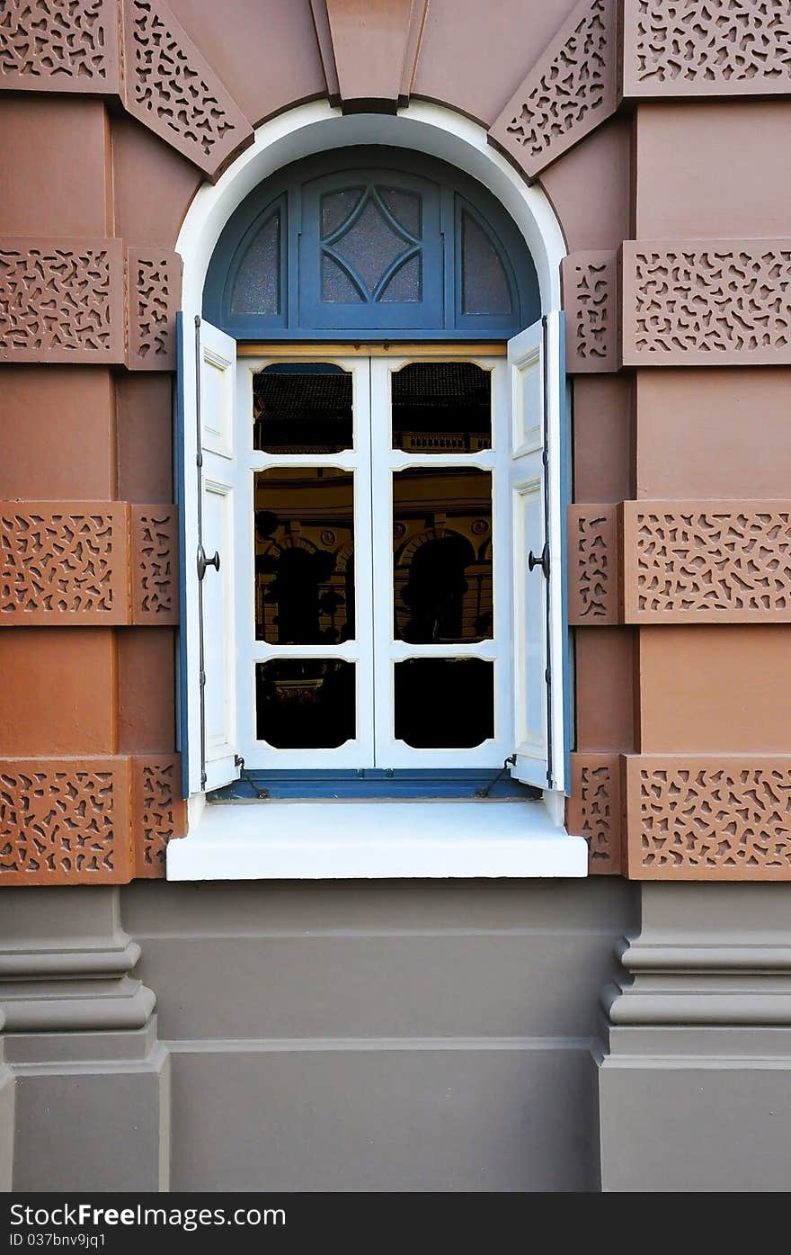 Blue modern window on brown wall. Blue modern window on brown wall