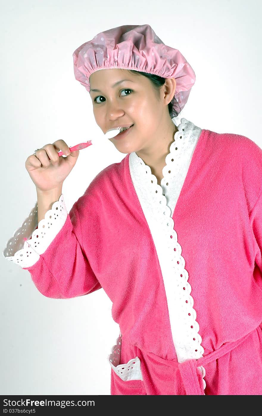 young woman brushing her teeth