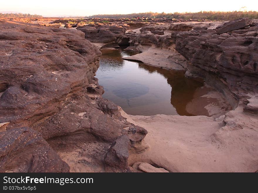 Small lake in rock canyon