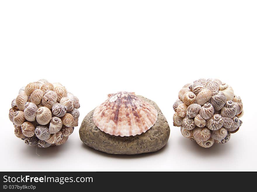 Ball with sea shells on stone