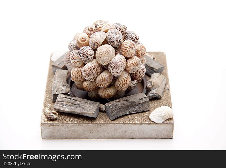 Ball with sea shells on stone